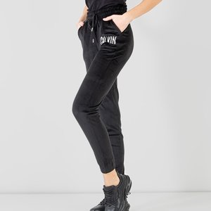 Черные женские спортивные штаны с серебряной надписью - Одежда