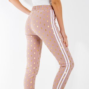 Нежно-розовые женские брюки в золотистый горошек