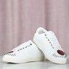Білі спортивні кросівки з прикрасами Nollisoa - Взуття