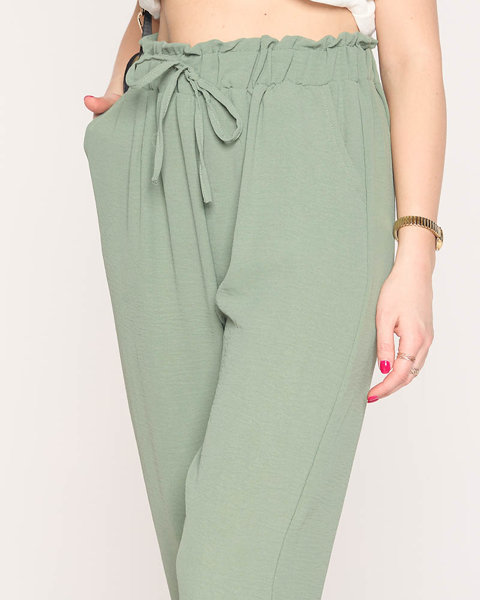 Жіночі тканинні штани зеленого кольору PLUS SIZE - Одяг